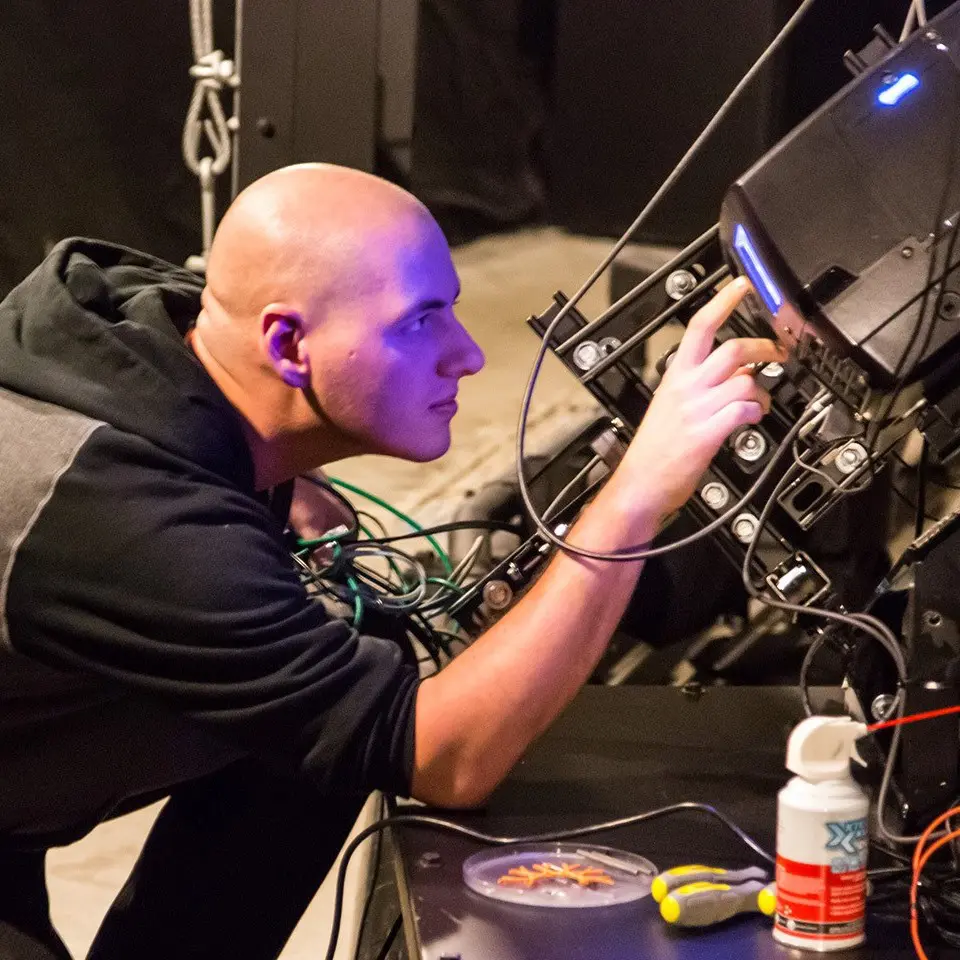 Dan maintaining a video projector