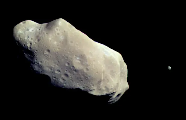 243_ida_crop Asteroid Ida and its moon Dactyl, discovered and photographed by the Galileo mission on its way to Jupiter.